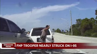 Video shows FHP trooper jumping out of the way of a speeding car
