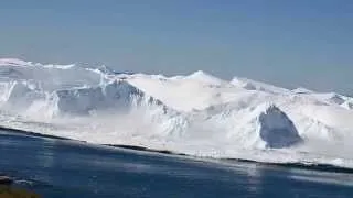 Ilulissat Icefjord - iceberg turning over.