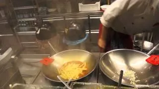 Making fresh pasta dish at Vapiano, Vienna, Austria