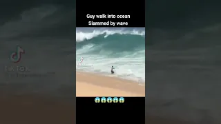 Guy walked into ocean slammed by waves