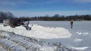 County plow opening drifted shut road in Randolph  County, IN