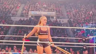 WE Live.5/8/22 Ronda Rousey hittingCharlotte Flair with Kendo sticks