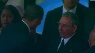 Obama shakes Raul Castro's hand