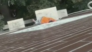 Boy dangles by head four storeys up: A boy gets his head stuck in railings and dangles from balcony