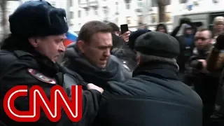 See Putin critic dragged away by Russian police