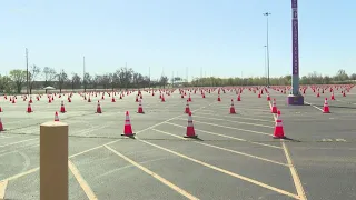 Crews work to turn UofL Cardinals football stadium into a 24 lane mass vaccination site