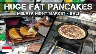 Street food - Huge fat pancakes at the Melaya night market at Bali in Indonesia