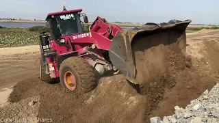 The Great Matadors Wheel Loader Pushing Sand and Rock For Base Road on development area.