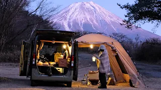 Car camping in a small car at the foot of Mt. Fuji