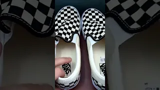 Unboxing the Vans Black & White Checkered Classic Slip Ons. Available at Surfboards.com