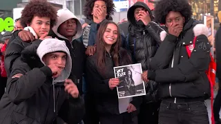 HANDING OUT FLYERS IN TIMES SQUARE