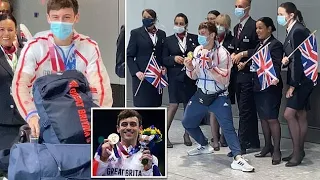 Tom Daley splashes down at Heathrow receiving a hero's welcome