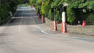 Ben and Tom Birchall from Mansfeild leads the sidecar race at the bottom of Bray Hill...