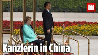 Bei der Hymne sitzt sie wieder | Kanzlerin Merkel zu Besuch in China