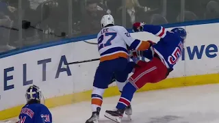 Anders Lee throws a retaliatory hit to Ryan Lindgren following the hit on Anthony Beauvillier