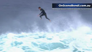 Surfboard snaps in two as surfers take on large waves in Bronte, NSW, Australia