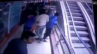 Baby dies after falling from mother's arms on escalator