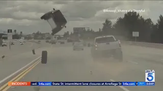 Runaway tire sends car flying into the air