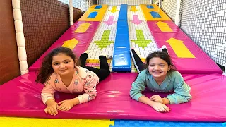 Masal and Öykü  have fun playing at the Indoor Playground for kids