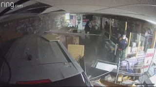 Thieves drive vehicles through stores to steal dozens of guns