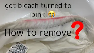 White clothes turned pink because of bleach(how to remove?)
