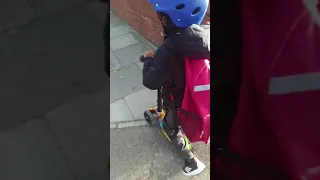 Toddler on Bold Cube scooter