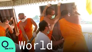 Monks Join Relief Efforts Against Devastating Thai Floods
