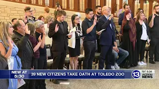 39 new American citizens take the oath at the Toledo Zoo to make it official