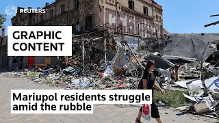 WARNING: GRAPHIC CONTENT - Mariupol residents struggle amid the rubble