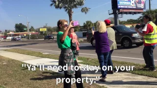 Protesters Greet Trump Outside MacDill Gates