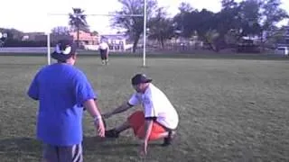 kid kicks a booming field goal