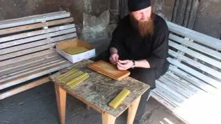 A monk rolling candles in Zarzma