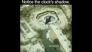 Mecca's clock tower casting its shadow.