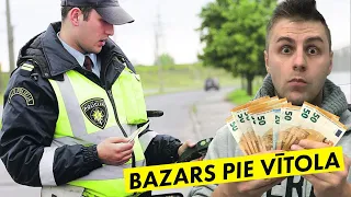 PAR KUKUĻDOŠANU CEĻU POLICISTAM (BAZARS PIE VĪTOLA)