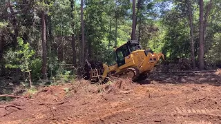 Cat 963 taking down trees