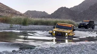 Jeep Rubicon JL crossing deep water.