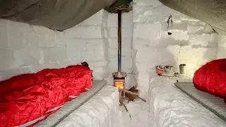 Snow Shelter with WOOD STOVE bushcraft camping in snow