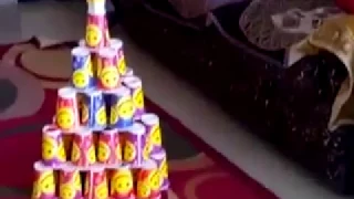 art of making pyramid tower with paper cups