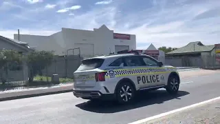 SAPOL Responding Code 1 to car flipped on roof.