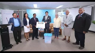 Fijian Attorney General officiates the handing over of education curriculum materials on Elections.