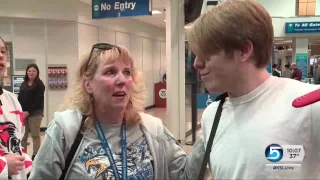 Cheering hockey family greets Sandy brothers who lost parents