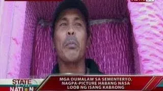 SONA: Mga dumalaw sa sementeryo, nagpa-picture habang nasa loob ng isang kabaong