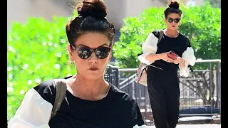 Catherine Zeta-Jones, 48, shows off her trim physique in frilled sleeve top as she heads to the gym