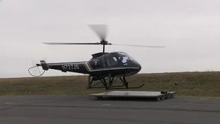 Enstrom 480b lands on custom heli cart