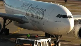 Airbus A330. Pushback at Airport Gate. Emirates Airline at Milano Malpensa