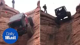 Jeep climbs near vertical rock face in unbelievable stunt - Daily Mail