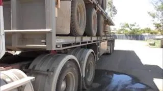 ROAD TRAIN PIGGY BACKING A TRAILER AND DOLLY