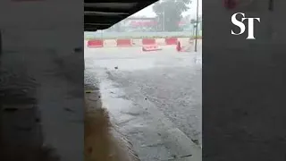 Barriers carried away by flood on Bukit Timah Road near The Nexus on Aug 24, 2021