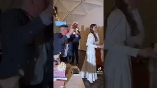 Drunk guy ruins wedding cake and gets punched