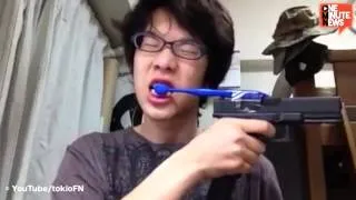 Japanese Kid Brushes His Teeth with a Gun